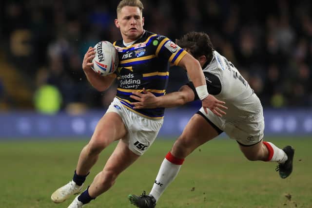 Leeds Rhinos' Brad Dwyer is tackled by Toronto Wolfpack's Jon Wilkin. Picture: PA.