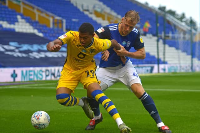 Swansea City danger man Rhian Brewster, left, in action  against Birmingham City's Marc Roberts. Picture: PA.