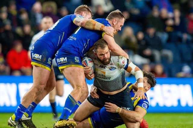 Adam Cuthbertson is tackled during Rhinos' big win over Warrington in February. Picture by Bruce Rollinson.