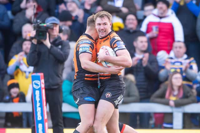 KEEP ON RUNNING: Castleford's Michael Shenton is congratulated on his try against Toronto by Greg Eden. Picture by Allan McKenzie/SWpix.com