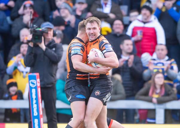 KEEP ON RUNNING: Castleford's Michael Shenton is congratulated on his try against Toronto by Greg Eden. Picture by Allan McKenzie/SWpix.com