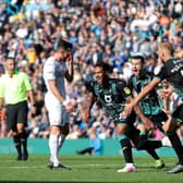SICKENER: Leeds United winger Jack Harrison shows his disappointment as Wayne Routledge and his Swansea City team-mates celebrate Routledge's late winner in August's triumph at Elland Road. Picture by Richard Sellers/PA Wire.