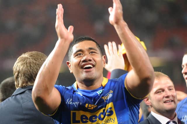 Ali Lauitiiti applauds the fans after ending his Rhinos career on a high in the 2011 Grand Final. Picture: Steve Riding.