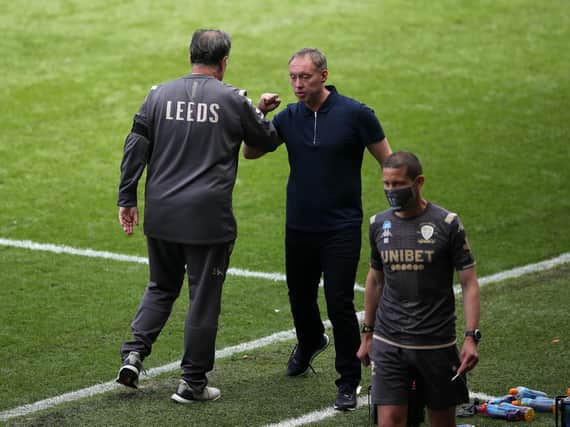 Leeds United's Marcelo Bielsa and Steve Cooper greet at the Liberty Stadium. (PA)