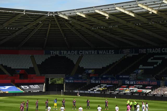 RESPECTS: Leeds United and Swansea City pay tribute to Jack Charlton at the Liberty Stadium in South Wales. Photo by Harry Trump/Getty Images.