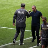 CHASING THE PREMIER: Leeds United head coach Marcelo Bielsa and Swansea City boss Steve Cooper after the full-time whistle of Sunday's clash in South Wales. Picture by Nick Potts/PA Wire.