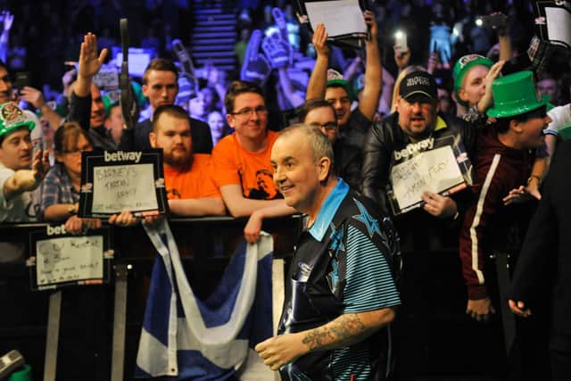 Now retired darts legend Phil Taylor makesa his walk-on in Leeds. Picture by Steve Riding.