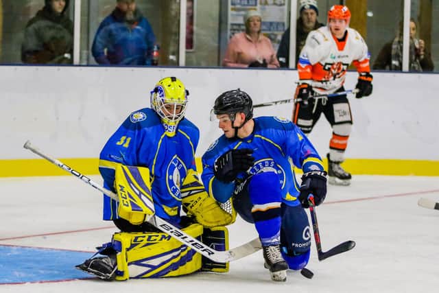 STAY OUT: Leeds Chiefs' netminder Sam Gospel and defenceman Lewis Baldwin (right) defend the net against Telford Tigers at Elland Road last season. Picture courtesy of Mark Ferriss