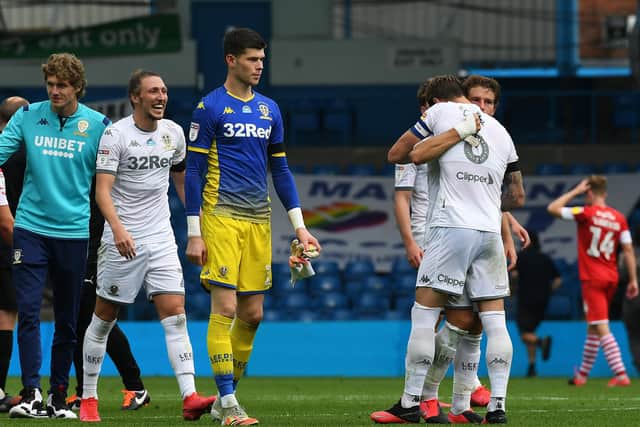 Leeds United captain Liam Cooper hugs Gaetano Berardi at full time in the Barnsley game. 
Picture: Jonathan Gawthorpe.