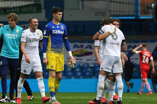 PROMOTED: Captain Liam Cooper hugs defender Gaetano Berardi as Luke Ayling beams from ear to bear following Thursday's 1-0 victory at home to Barnsley which has sealed a return to the Premier League. Picture by Jonathan Gawthorpe.