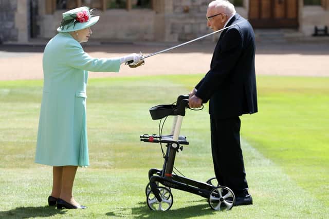 Captain Tom Moore being knighted by The Queen in ceremony at Windsor Castle