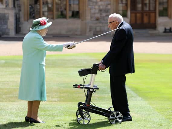 Captain Tom Moore being knighted by The Queen in ceremony at Windsor Castle