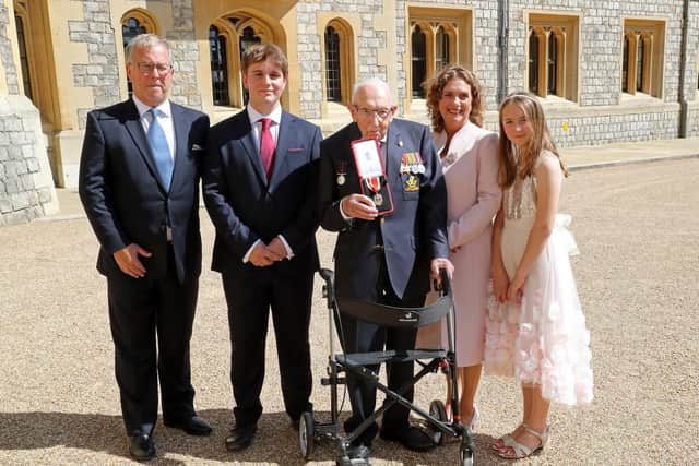 Captain Sir Thomas Moore with his family after he received his knighthood from The Queen