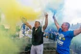 The party starts again. Leeds United fans celebrating outside Elland Road.