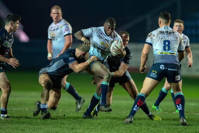 Muizz Mustapha, with ball, playing for Leeds in a pre-season game at Featherstone. Picture by Bruce Rollinson.