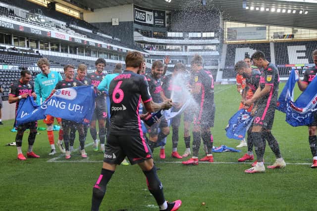 CHAMPIONS - Leeds United celebrated their league title and promotion at full-time. Pic: Leeds United