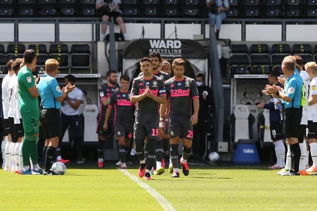 STROLL - Pablo Hernandez and Leeds United walk through Derby County's guard of honour at Pride Park. Pic: Leeds United