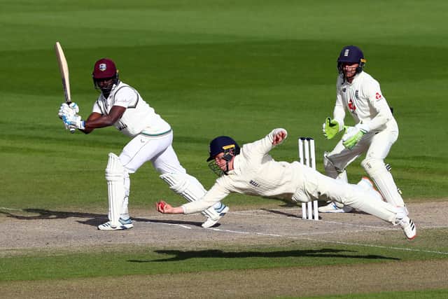 England's Ollie Pope takes the winning catch to dismiss West Indies' Kemar Roach Picture: Michael Steele/NMC Pool/PA
