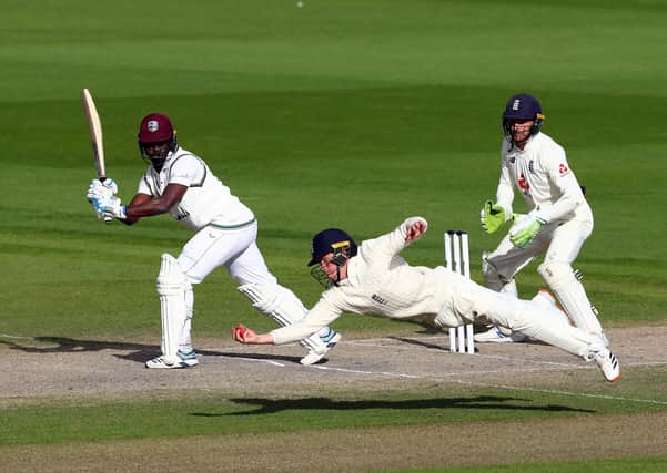 England's Ollie Pope takes the winning catch to dismiss West Indies' Kemar Roach Picture: Michael Steele/NMC Pool/PA