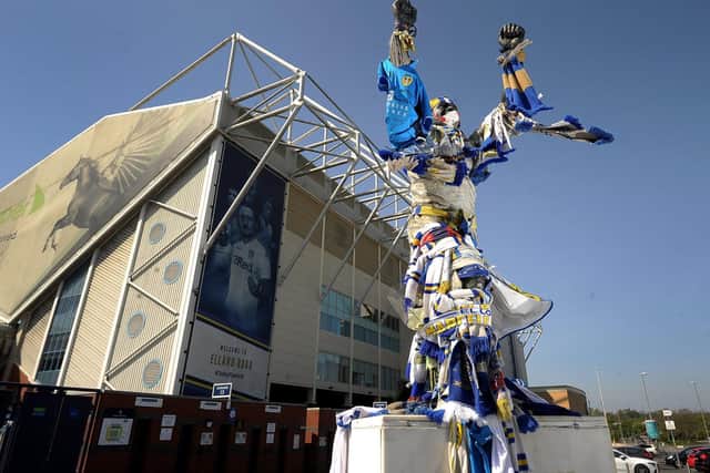 The Billy Bremner statue outside Elland Road is adorned with memorabilia following the celebrations.