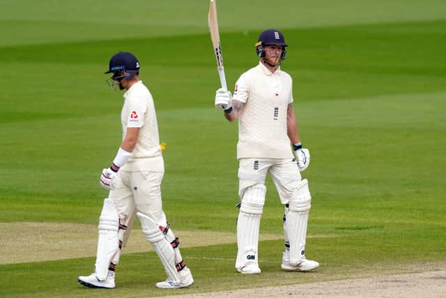 England's Ben Stokes raises his bat after reaching his half century on Monday at Old Trafford. Picture: Jon Super/NMC Pool/PA