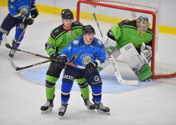 Joe Coulter battles with Hull Pirates' Thomas Stubley at Elland Road Ice Arena last season. Picture: Dean Woolley.