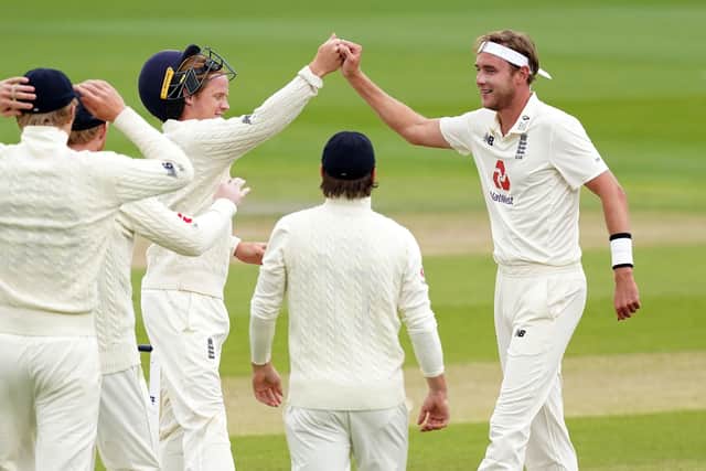 England's Stuart Broad celebrates with his team-mates after taking the wicket of West Indies' Roston Chase at Old Trafford on day five. Picture: Jon Super/NMC Pool/PA