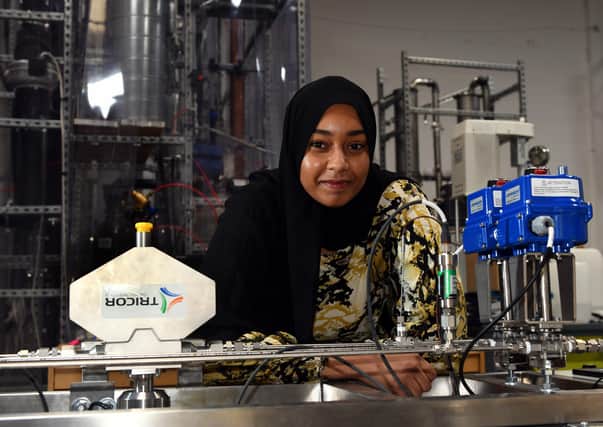 Fatima Bilal, a project engineer at  C-Capture in Leeds, with a  VLE Lab Scale model machine that finds out the vicosity  of C-Capture solvents with flow. Picture: Gary Longbottom