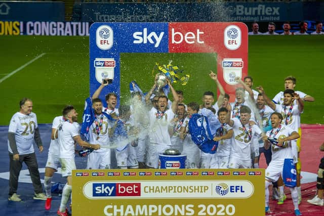 CHAMPIONS - Leeds United celebrating with the Championship trophy after a 4-0 win over Charlton Athletic. Pic: Tony Johnson