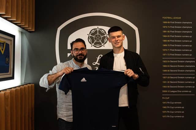 PERMANENT - French goalkeeper Illan Meslier, pictured with director of football Victor Orta, has signed a three-year deal with Leeds United who took the option to make his loan move permanent