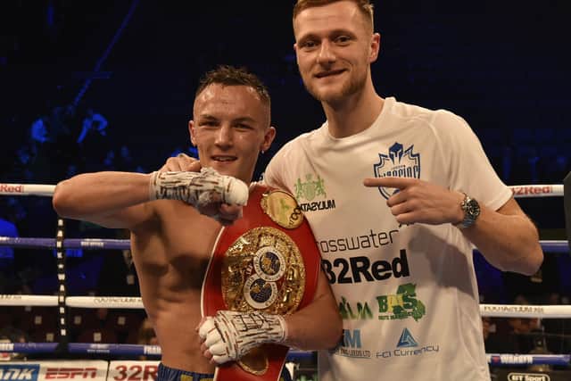 Leeds United captain Liam Cooper with IBF featherweight world champion and Whites fan Josh Warrington. Picture: Steve Riding.