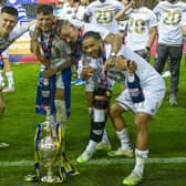 Leeds United players 
Illan Meslier, Ben White, Kalvin Phillips and Tyler Roberts pose with the Championship trophy. Picture: Tony Johnson/JPIMedia.