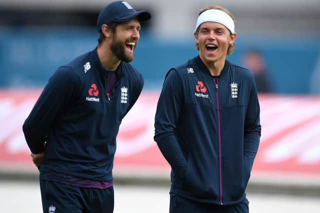 England's Chris Woakes (left) shares a joke with Sam Curran during the nets session at Emirates Old Trafford. Picture: Gareth Copley/Pool/PA