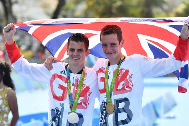 Jonathan Brownlee and Alistair Brownlee with their silver and gold medals after the 2016 Rio Olympics. Picture: Getty Images.