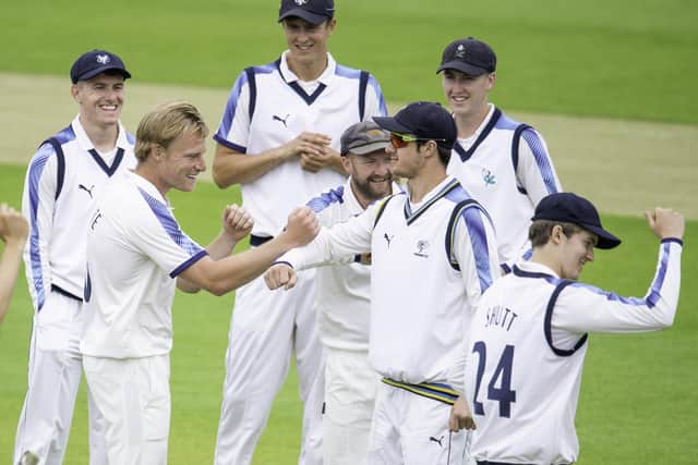 Well done: Yorkshire's Matthew Waite is congratulated on dismissing Lancashire's Rob Jones. Pictures: SWPix