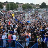 Leeds United fans celebrate outside Elland Road (photo: Danny Lawson / PA Wire).