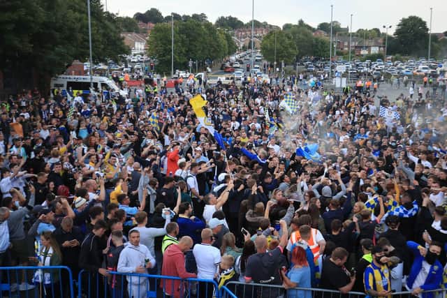 Leeds United fans celebrate outside Elland Road (photo: Danny Lawson / PA Wire).