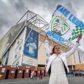 A fan outside Elland Road flying the flag for the champions.