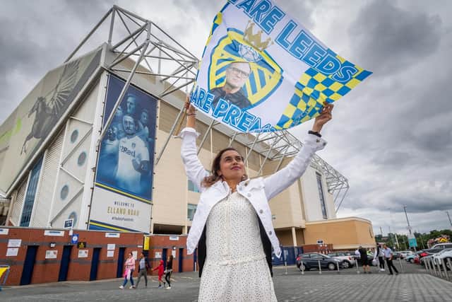 A fan outside Elland Road flying the flag for the champions.