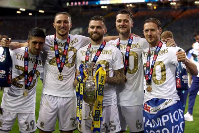 Stuart Dallas celebrates with his team-mates after lifting the Championship trophy at Elland Road. (PA)