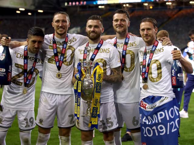Stuart Dallas celebrates with his team-mates after lifting the Championship trophy at Elland Road. (PA)