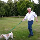 Undated handout screengrab from a video posted by Number 10 Downing Street of Prime Minister Boris Johnson walking his dog Dilyn as he marks the launch of the Government's obesity strategy. Photo credit: Number 10 Downing Street/PA Wire