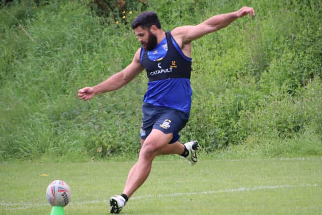 Rhyse Martin practices his kicking in training. Picture by Varley Picture Agency.