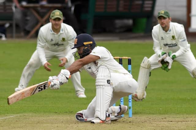 Azeem Rafiq, of Cleckheaton, reaches for a wide ball in the Bradford League game against New Farnley. Picture: Gary Longbottom/JPIMedia.