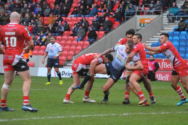 Alex Mellor is tackled during Rhinos' victory at Salford in February. Picture by Steve Riding.