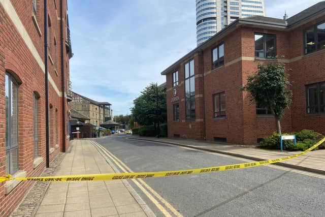 There is a large police cordon spanning more than 100m away from the river