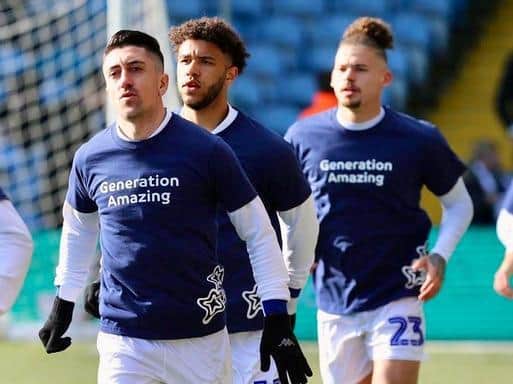 SUPPORT - Leeds United stars Pablo Hernandez, Tyler Roberts and Kalvin Phillips warming up at Elland Road in Generation Amazing shirts.