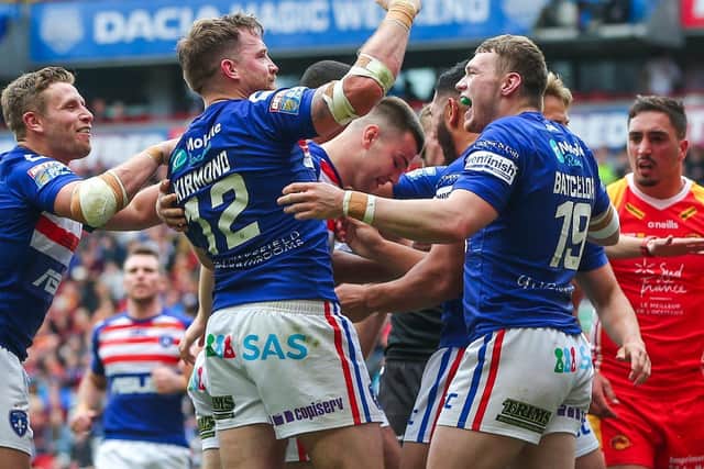 Wakefield's Danny Kirmond celebraqtes scoring against Catalans at last year's Magic Weekend. Picture by Alex Whitehead/SWpix.com.