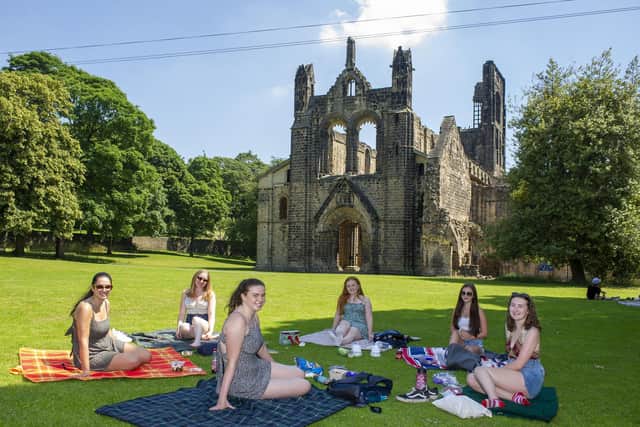 Students enjoy the sunshine in the grounds of Kirkstall Abbey as the heatwave continues across the county. Picture Tony Johnson