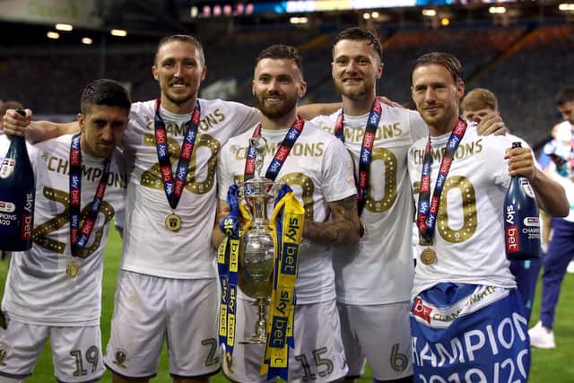 Leeds United's Stuart Dallas (middle) celebrates lifting the Championship trophy.